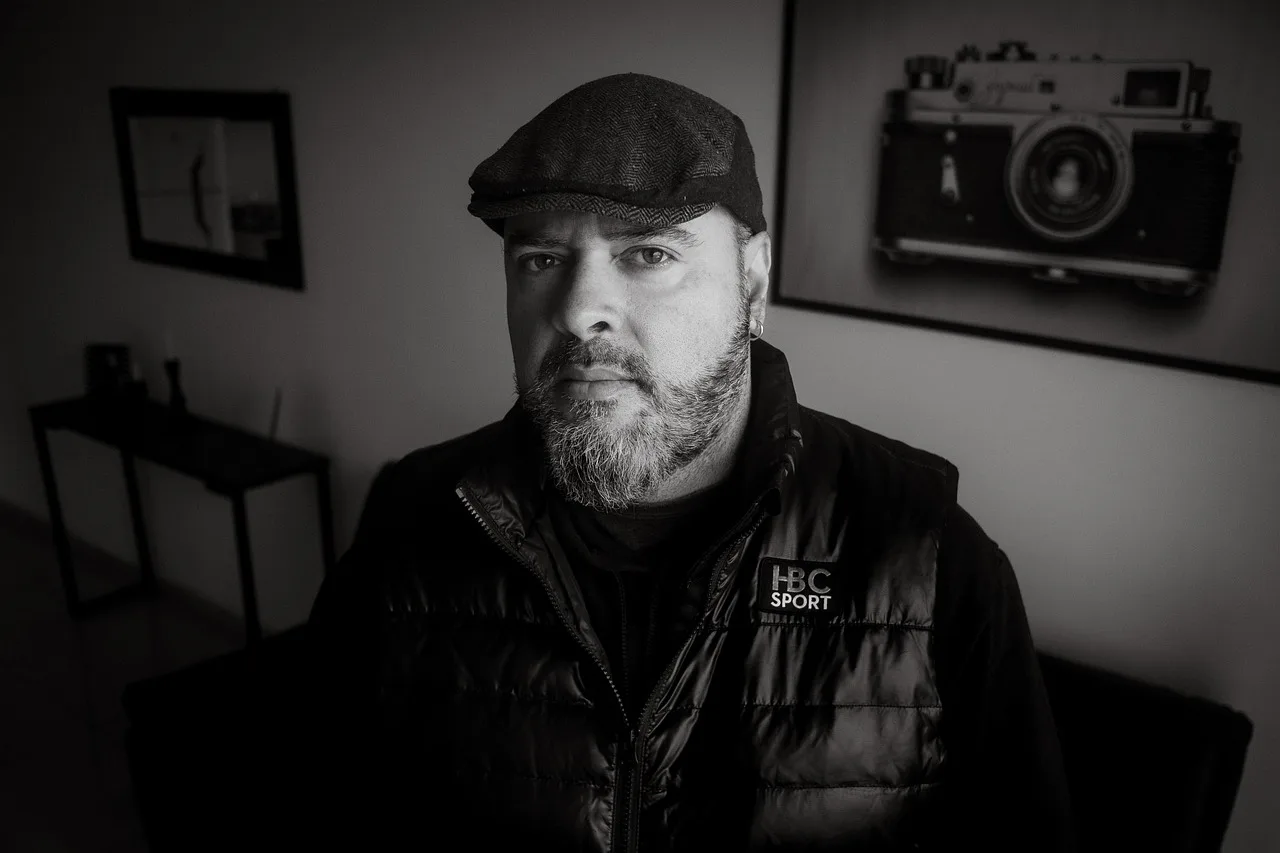man, beard, cap, vest, gilet, retro, fashion, style, wall decor, console table, monochrome, black and white, portrait, man, man, man, man, man, cap, black and white. Photo booth rental profit margin: a method, not a number